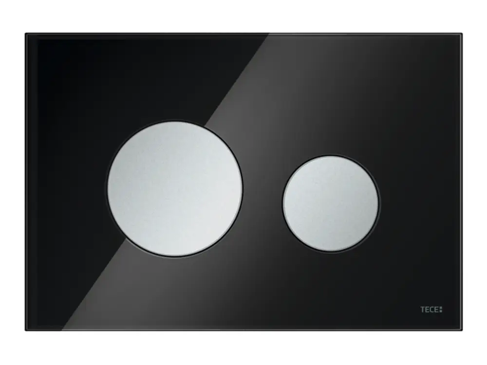 Betätigungsplatte aus schwarzem Glas mit zwei runden Tasten in Chrom. Produkt von TECE zur Steuerung eines WC. Minimalistisches Design ohne zusätzliche Beschriftungen.